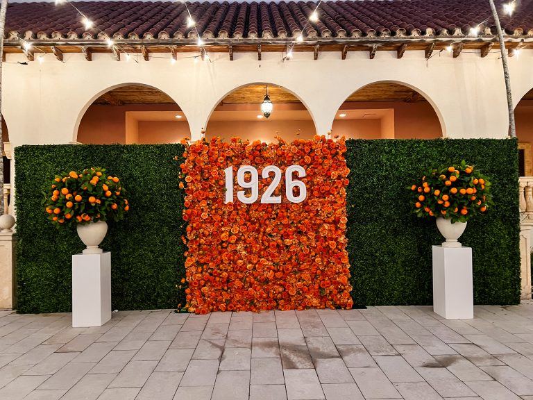 Celebrating 99 Years of Elegance: PINK.’s Orange Dream Flower Wall at The Boca Raton Anniversary Party